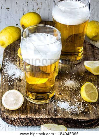Ingredients for mexican chilean drink Michelada - beer, salt, lemon