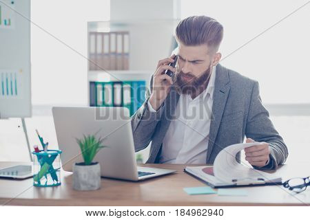 Confident Handsome Young Man Is Having A Business Conversation, Checking Information On Papers And C