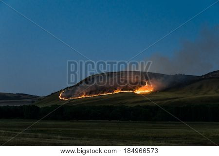 Forest fires on the mountain at night