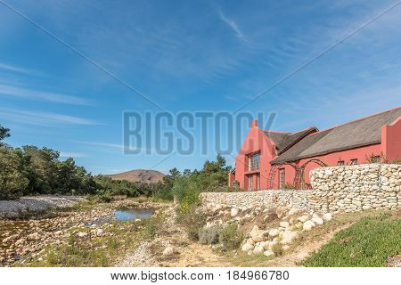 GREYTON SOUTH AFRICA - MARCH 27 2017: A view of Gobos riverbed and a house in Greyton a small town in the Western Cape Province of South Africa