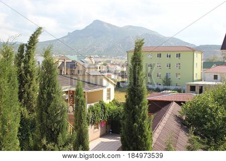 Russia. Crimea for travelers. Landscape blue sky with clouds, mountains, residential buildings
