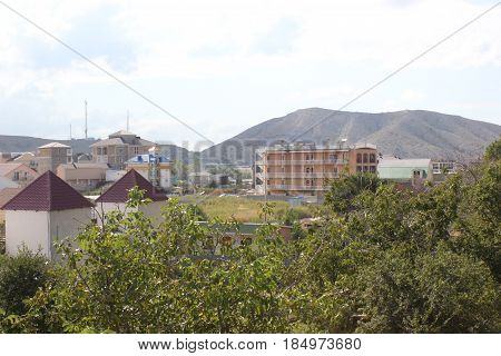 Russia. Crimea for travelers. Landscape blue sky with clouds, mountains, residential buildings