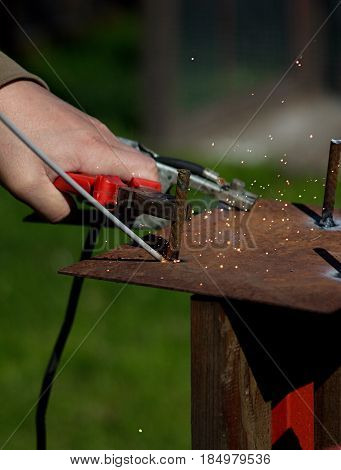 Detail of the welding of the metal material by the electrode