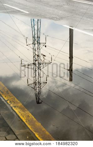Reflection In Large Puddle On An Overcast Day