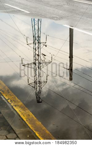 Reflection In Large Puddle On An Overcast Day