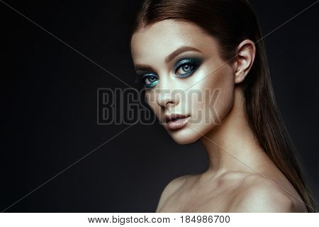 Fashion model Woman with fantasy make up. Long blowing brown hair. Fantasy Girl. Mermaid.