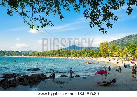 Tourists on the Kata beach - one of the best beaches in Phuket, Thailand