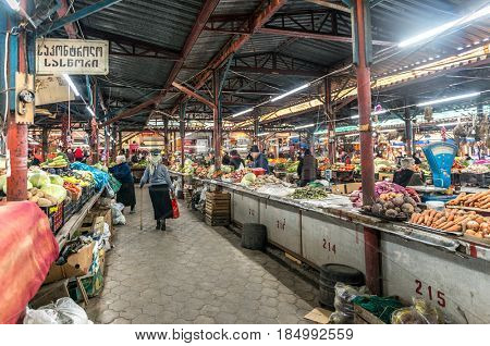 KUTAISI, GEORGIA, NOVEMBER, 05: Long rows of homegrown farmer's fresh vegetables in Kutaisi, georgian marketplace, bazaar on nowember, 05, 2016 in Georgia