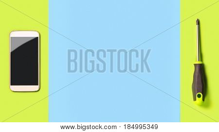 Smartphone repair background or advertisement template for phone fixing company. Free blank copy space for text and content. Mobile and screwdriver on colorful vibrant light green and blue texture.