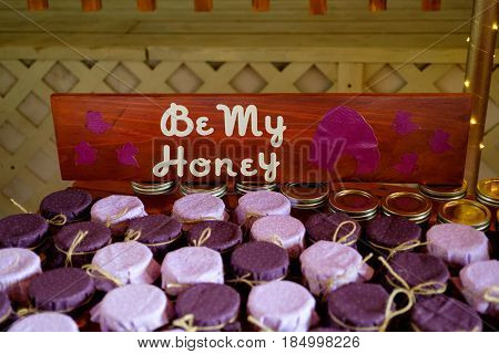 Party favors of local Oregon honey at a wedding reception.