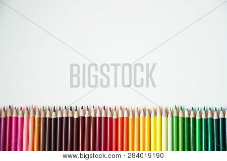 Many Multi-colored Pencils.
Background With Color Pencils. Rainbow Colors, Palette. Bright And Color