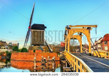 Molen De Put Mill And The Rembrandt Bridge In Leiden - South Holland, The Netherlands