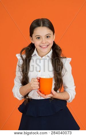 Girl Kid School Uniform Orange Background. Schoolgirl Hold Mug. School Lunch. Drinking Tea While Bre