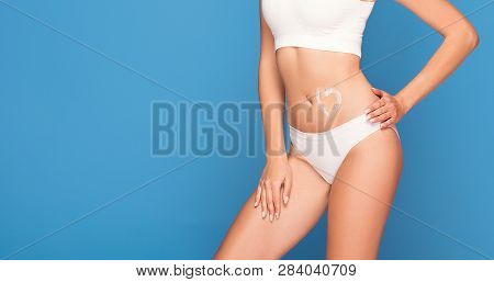 Caucasian Woman With Soft And Smooth Skin Posing In White Underwear. Cream On Her Body .healthy Life