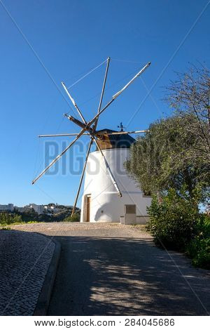 ALBUFEIRA, PORTUGAL - FEBRUARY 8, 2019: Recently Restored Traditional Windmill On Moinho Cerro Malpique In Albufeira The Algarve Portugal