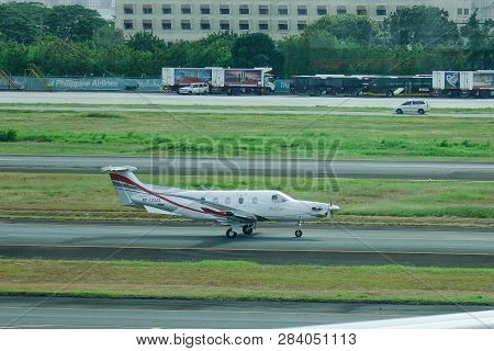 Manila, Philippines - Dec 4, 2018. A Pilatus Pc-12 Ng Private Jet Taxiing On Runway Of Manila Naia A