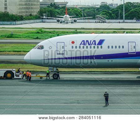 Passenger Airplane At Manila Airport, Philippines