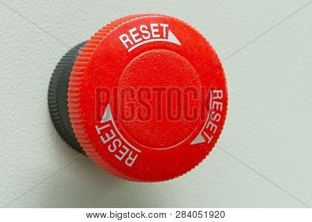Red Emergency Stop And Reset Button On Control Panel.