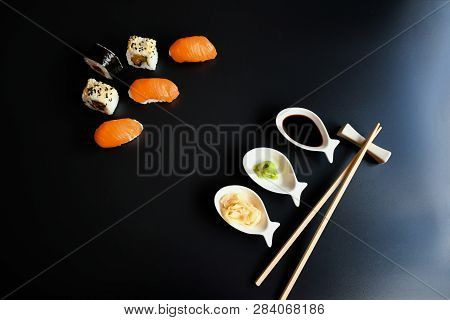 Close Up Top View Mix Sushi With Various Ingrediant As Salmon, Tuna, Avocado,sesame On Black Backgro