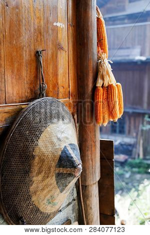 Chinese Traditional Bamboo Hat Hanging On A Farmers House