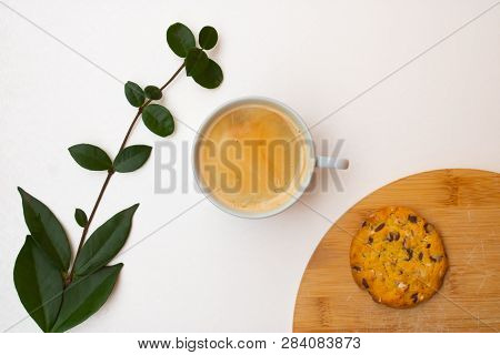 Coffee Cup, Branch And Cookie On The Chopping Board