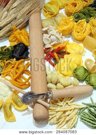 Italian Homemade Pasta With A Kitchen Rolling Pin And Ears Of Ripe Wheat And A Raviolo With Cuttlefi