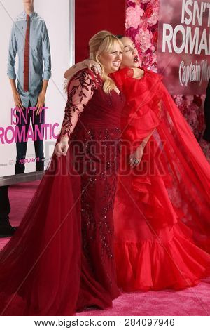 LOS ANGELES - FEB 11:  Rebel Wilson, Miley Cyrus at the 