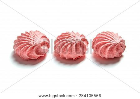 Row Of Meringue. Meringues Kisses In Pink Color. Airy And Practically Weightless Biscuits Based On E
