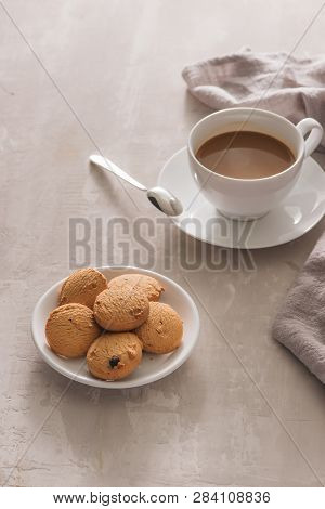 White Cup Of Creamy Coffee With Butter Cookies And Stainless Teaspoon Isolated On White Background, 
