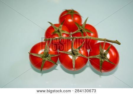 Bunch Of Fresh Cherry Tomatoes On The Table