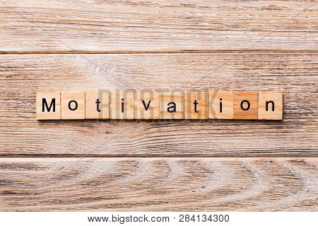 Motivation Word Written On Wood Block. Motivation Text On Wooden Table For Your Desing, Concept