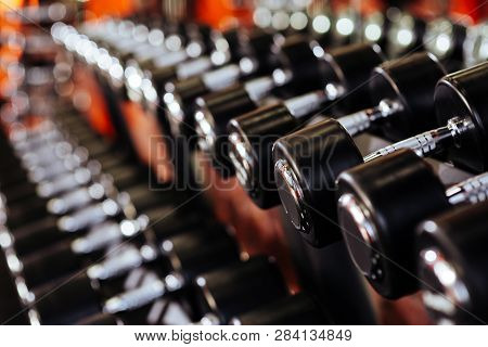 Rows Of Dumbbells In The Gym With Hign Contrast In The Gym