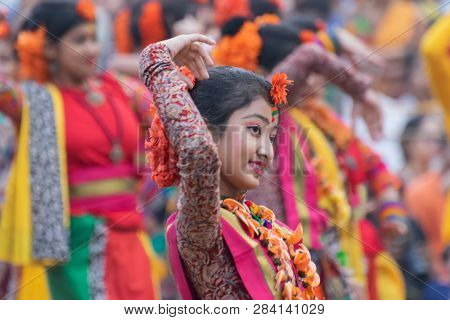 Kolkata, India - March 1, 2018 : Dancing Poses Of Girl Dancers , Dressed In Bright Red Coloured Sari