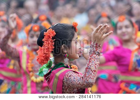 Kolkata, India - March 1, 2018 : Dancing Poses Of Girl Dancers , Dressed In Bright Red Coloured Sari