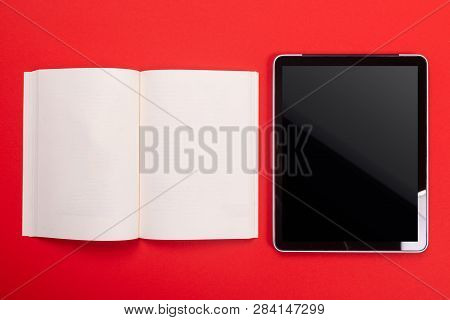 Noteboook And Tablet Isolated On Red Background