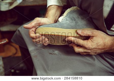 Enjoying Process Of Creation Custom Made Shoes. Workplace Of Shoe Designer. Hands Of Shoemaker Deali