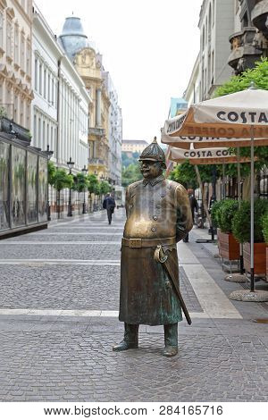 Budapest, Hungary - July 13, 2015: The Fat Policeman Brass Statue At Zrinyi Street In Budapest, Hung