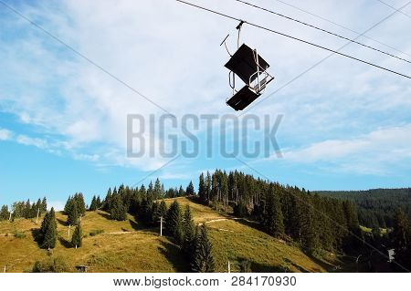 Lifting Chair And Picturesque View Of The Carpathian Mountains In Vatra Dornei, Romania.