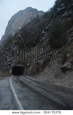 Road In A Tunnel Caught In The Rock Of A Gorge That Surrounds The Plandescun Reservoir A Rainy Day I
