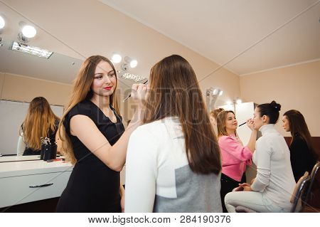 Make-up Artist Doing Professional Make-up Of Young Woman.