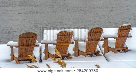 Lake Deck With Chairs On Snowy Winter Day In Utah