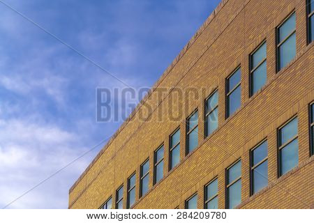 Modern Building Exterior Under Bright Blue Sky