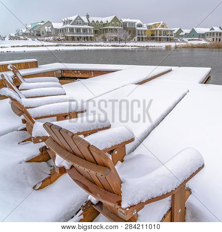 Winter In Daybreak Utah With Chairs On A Lake Deck