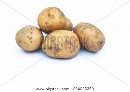 Close Up Of Raw Organic Potato Or Solanum Tuberosumor Aaloo Or Alu Isolated On White.