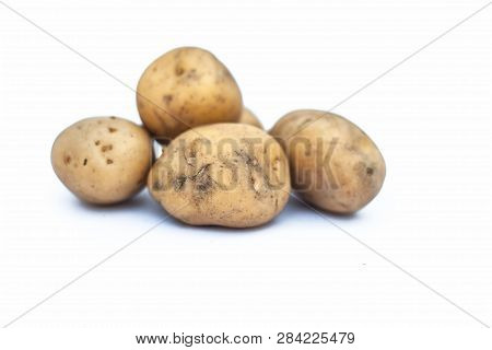 Close Up Of Raw Organic Potato Or Solanum Tuberosumor Aaloo Or Alu Isolated On White.