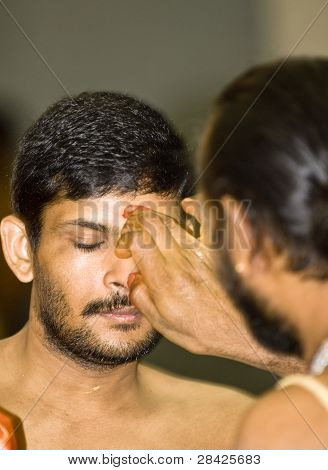 Hindu Priest Places A Mark On The Forehead Of A Hindu Devotee During The Chariot Festival At Richmom