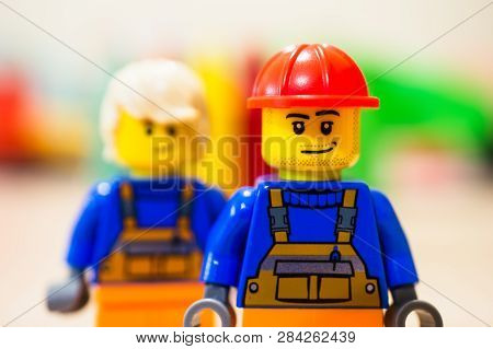 Poznan, Poland - February 13, 2019: Lego Construction Worker With Satisfied Emotion Standing In Fron