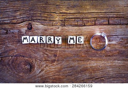 Will You Marry Me? An Offer Of Marriage On Rustic Background. Wording 