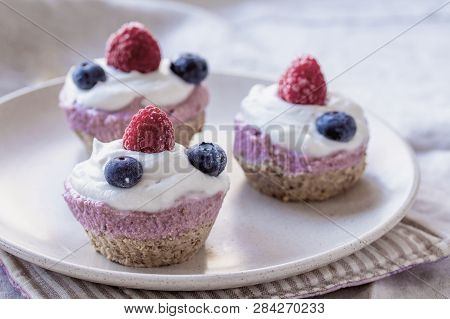 Homemade Cake With Raw Strawberries And Cashew Cream On Almond Nut Dough, Healthy Vegan Food Concept