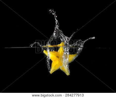 Exotic Fruits From Thailand. Star Fruit Falling Into The Water